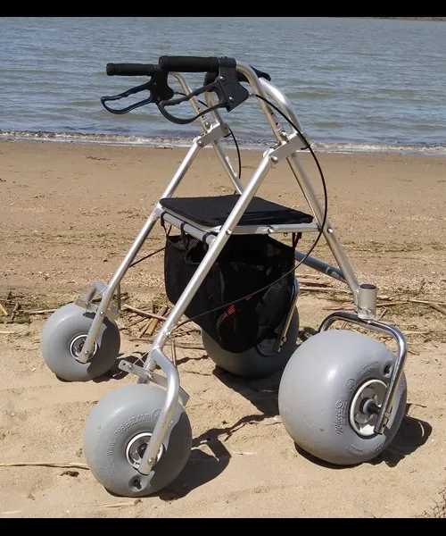 All-terrain rollator with large balloon wheels on a sandy beach