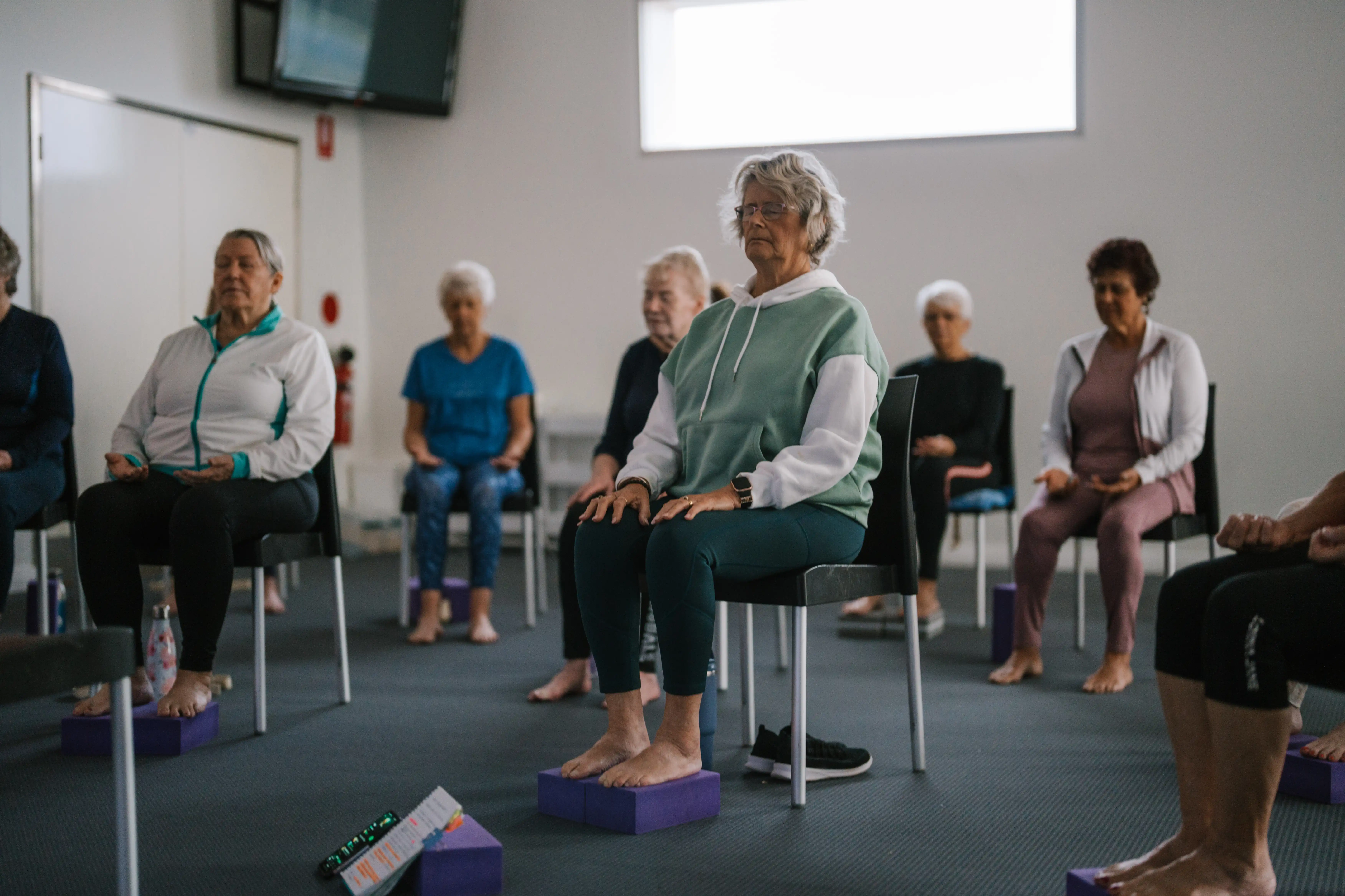 Class of people doing chair yoga at the MARC